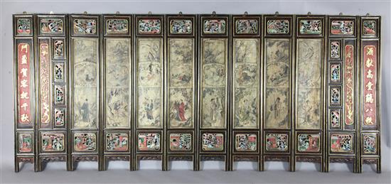 A Chinese 12 panel polychrome and gilt wood screen, 19th century, 274cm x 118cm, hinges removed for hanging
